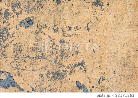 Texture of a concrete wall with cracks and scratches Texture of a concrete wall with cracks and scratches 58171562