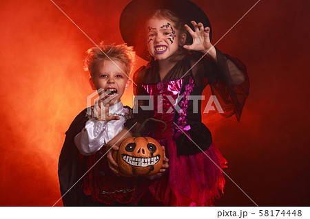 happy children girl and boy in costumes of witch happy children girl and boy in costumes of witch 58174448