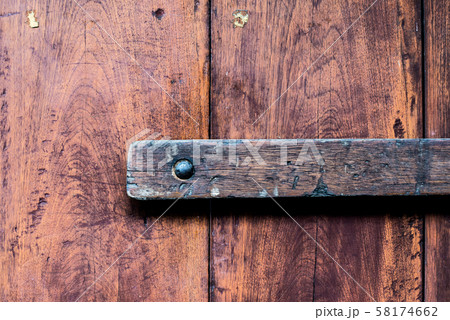 Rusty lock of old gates.Vintage door with metal handle. 58174662