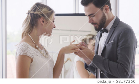 Bride and groom in wedding dress prepare ceremony. Bride and groom in wedding dress prepare ceremony. 58177250