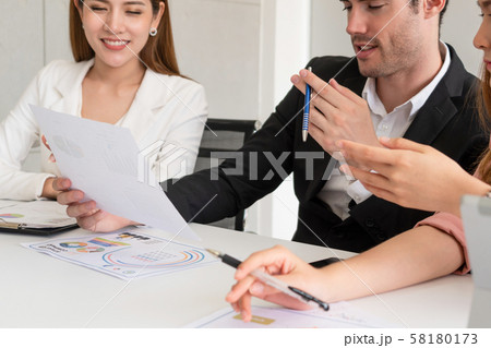 Businessman and businesswomen working in office. 58180173