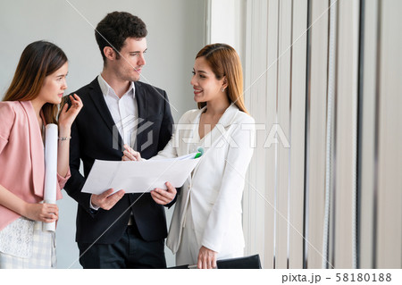 Businessman and businesswomen working in office. Businessman and businesswomen working in office. 58180188