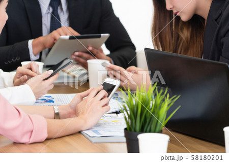 Businessman and businesswomen working in office. 58180201