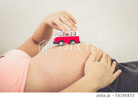Happy pregnant woman and expecting baby at home. 58180833