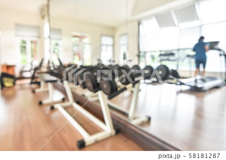 Blur gym background fitness center or health club with blurry sports exercise equipment for aerobic workout and bodybuilding Blur gym background fitness center or health club with blurry sports exercise equipment for aerobic workout and bodybuilding 58181287