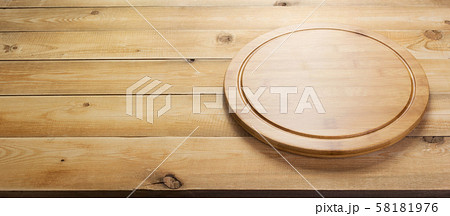 pizza cutting board at rustic wooden table pizza cutting board at rustic wooden table 58181976