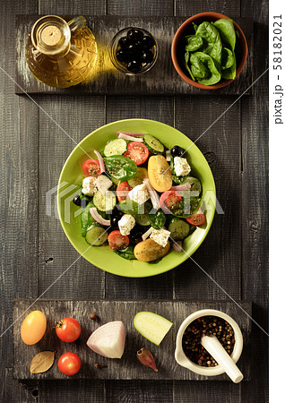 fresh greek salad in plate and ingredients fresh greek salad in plate and ingredients 58182021