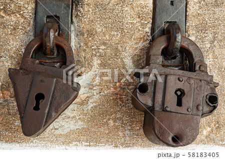 Two ancient rusty padlocks with keyhole Two ancient rusty padlocks with keyhole 58183405