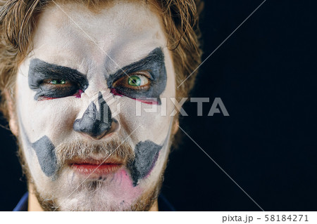 Masked man of the day of death on Halloween 58184271