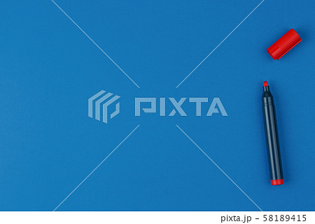 red marker on the blue table top view 58189415