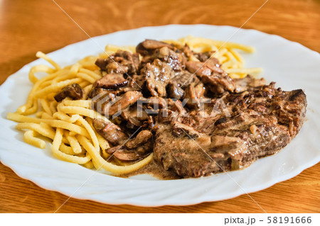 Beef with mushroom sauce and spatzle 58191666
