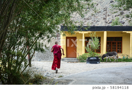 A monk at ancient Tibetan temple 58194118