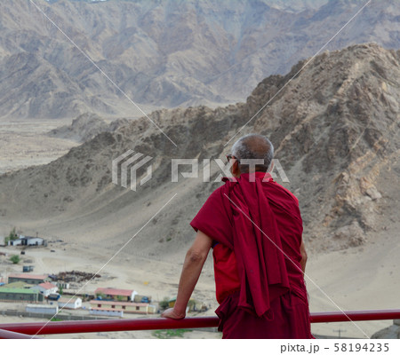 A monk at ancient Tibetan temple 58194235