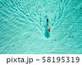 Top down view of a girl swimming in a lagoon 58195319