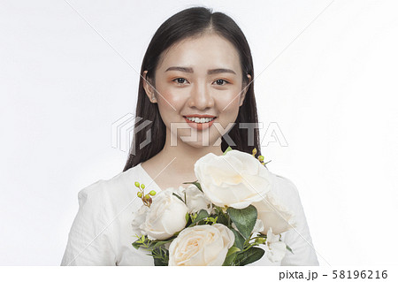 Asian Beauty young woman with clean skin on white Asian Beauty young woman with clean skin on white 58196216