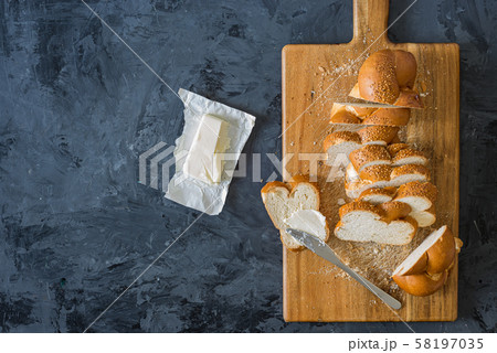 Jewish challah bread, sliced on black background 58197035