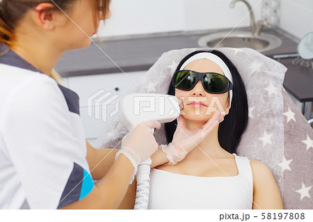 Body Care. Underarm Laser Hair Removal. Beautician Removing Hair Of Young Woman's Armpit. Laser Body Care. Underarm Laser Hair Removal. Beautician Removing Hair Of Young Woman's Armpit. Laser 58197808