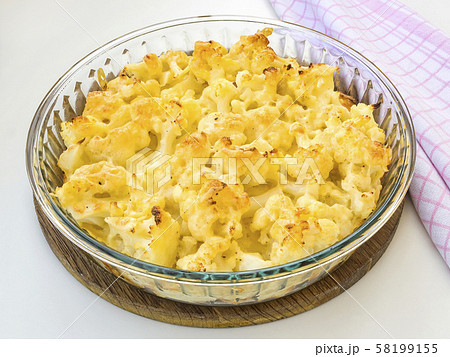 Baked fresh cauliflower with cheese and beaten egg. Baked fresh cauliflower with cheese and beaten egg. 58199155