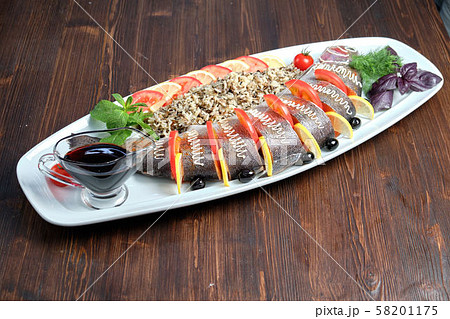 Stuffed fish with vegetables and rice. catering menu Stuffed fish with vegetables and rice. catering menu 58201175