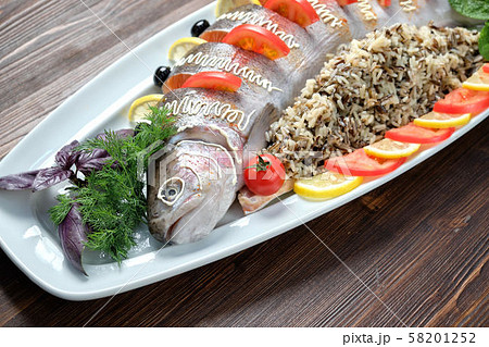 Stuffed fish with vegetables and rice. catering menu Stuffed fish with vegetables and rice. catering menu 58201252