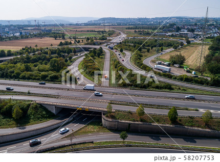 Aerial view of a highway intersection with a clover-leaf interchange Germany Koblenz Aerial view of a highway intersection with a clover-leaf interchange Germany Koblenz 58207753