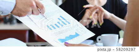 businessmen meet in cafe discuss documents 58209297