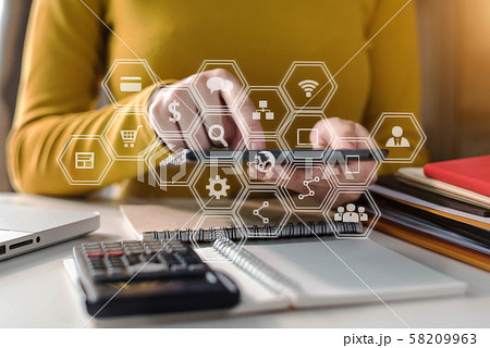 Female working on desk office with using a calculator to calculate tax. Female working on desk office with using a calculator to calculate tax. 58209963