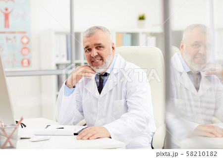 Senior male doctor at office 58210182