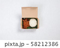 Sticky rice with shredded pork put in a brown paper box 58212386