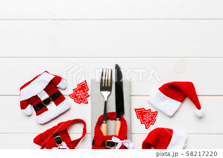 Festive set of fork and knife on wooden Festive set of fork and knife on wooden 58217220