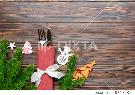 Top view of fork and knife on napkin with Top view of fork and knife on napkin with 58217236