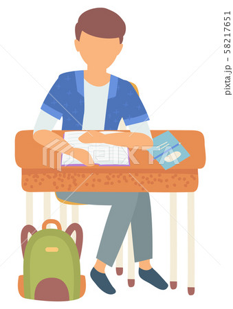 Schoolboy Doing Homework Assignments at Lesson 58217651