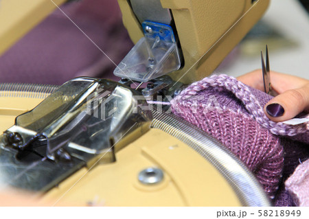 Looping machine operator working Looping machine operator working 58218949
