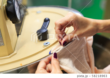 Looping machine operator working Looping machine operator working 58218963