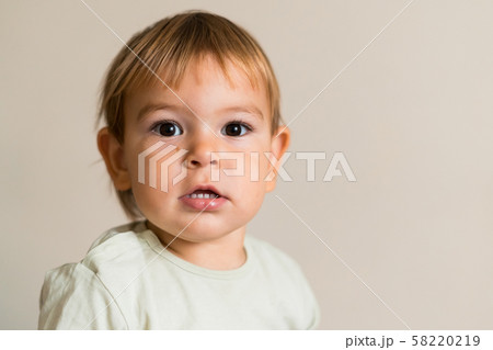 Portrait of cute baby boy isolated on the white background. Copy space. One year old Portrait of cute baby boy isolated on the white background. Copy space. One year old 58220219