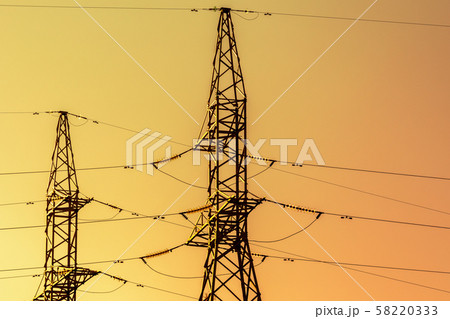 Silhouettes of High voltage electric towers 58220333