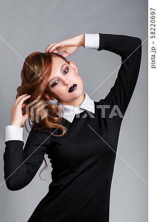 Dark makeup. Beautiful young fashion girl with 58220697