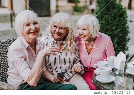 Three beautiful ladies sitting in the cafe Three beautiful ladies sitting in the cafe 58223412