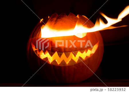 Spooky halloween pumpkin has hot fire flame eyes 58223932