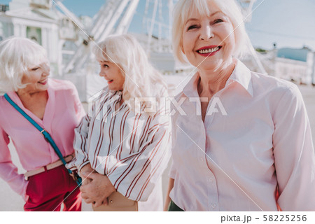 Nice older ladies are laughing together outdoor 58225256