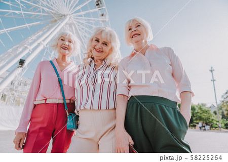 Friendly meeting of old friends in park 58225264