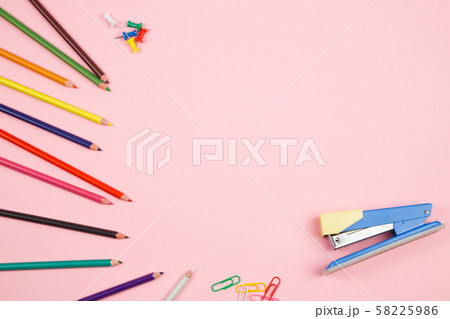 colored pencils and stationery on pink isolated colored pencils and stationery on pink isolated 58225986