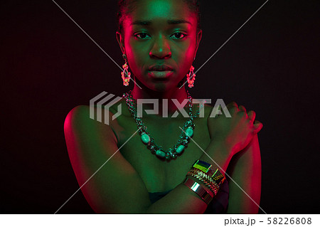 Sensuous Woman Wearing Jewelry Over Black Background 58226808