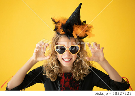 Beautiful girl dressed witch costume 58227225