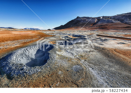 Boiling mudpots in the geothermal area Hverir and Boiling mudpots in the geothermal area Hverir and 58227434