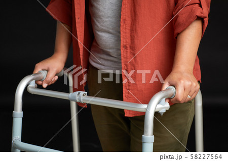 Woman walking with walker 58227564