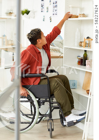 Disabled woman at home Disabled woman at home 58227624