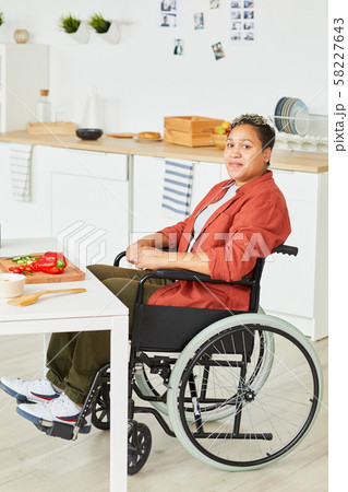 Disabled woman in domestic kitchen 58227643