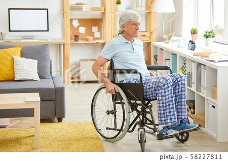 Disabled man in domestic room 58227811