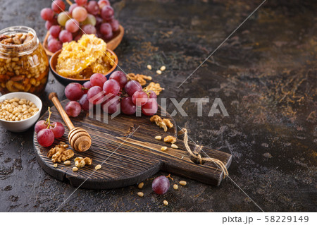 Honey, grapes and nuts 58229149